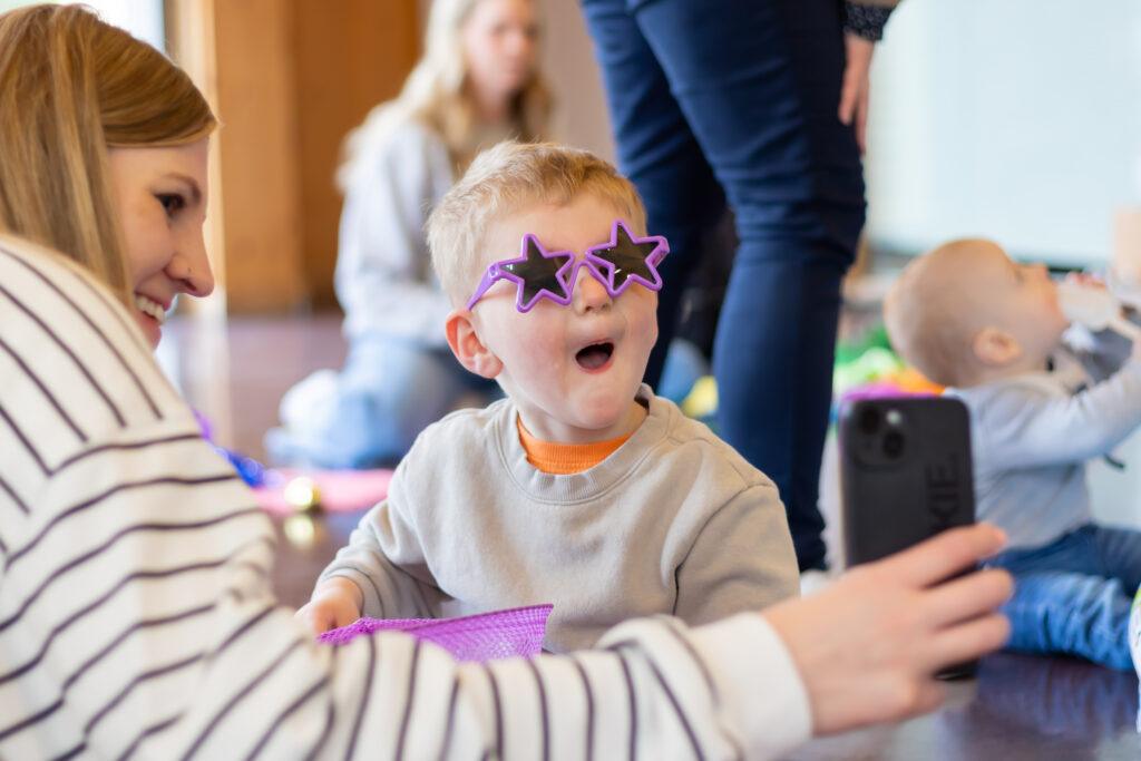 boy dressed up in sunglasses